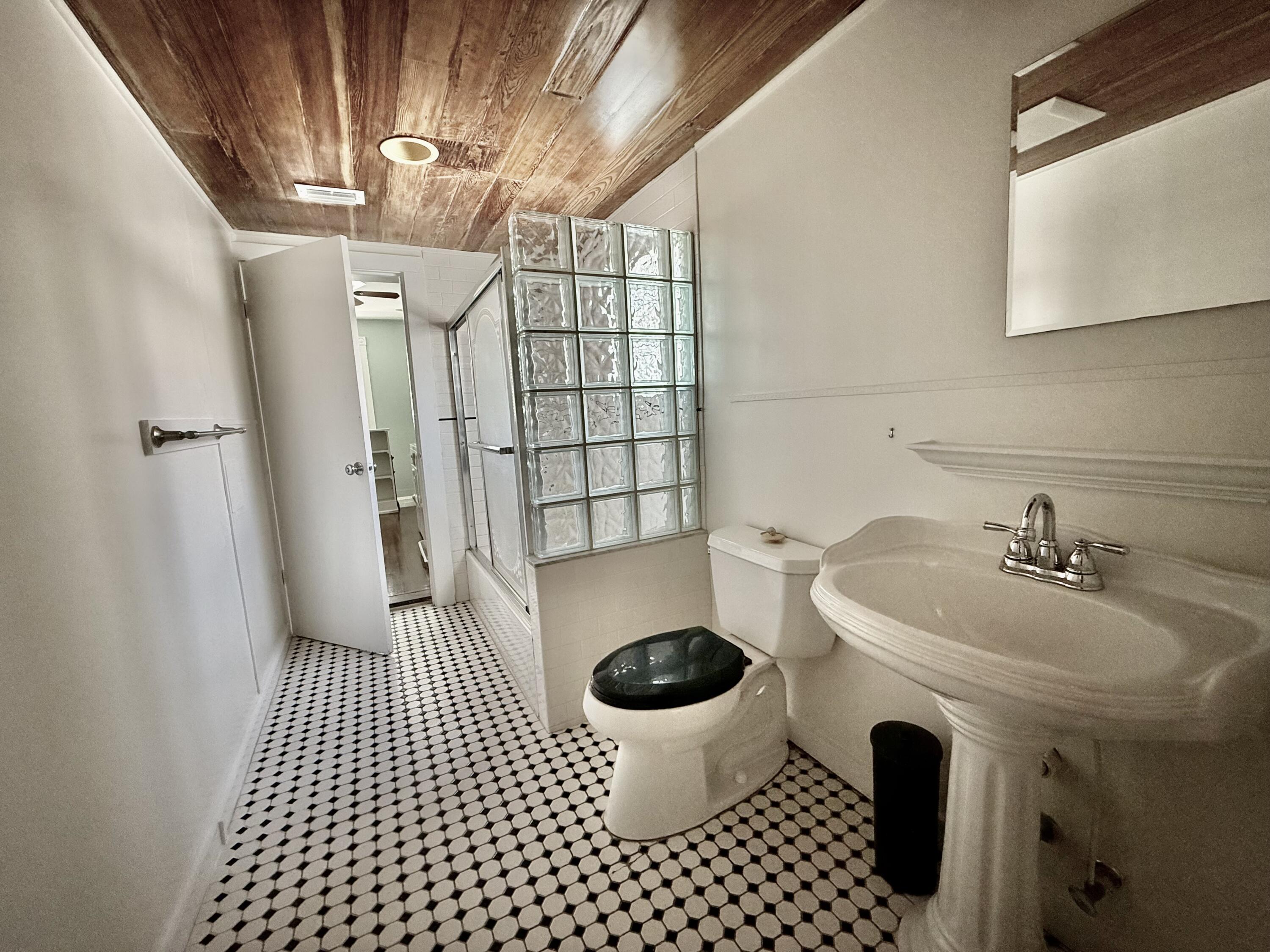 728 Ashe Street Key West, FL 33040 - Photo 23 of 25 a bathroom with a sink toilet and shower