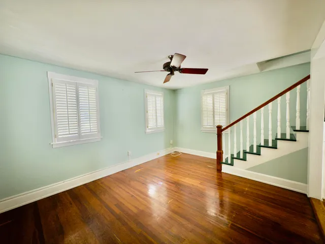 a view of entryway and hall with wooden floor