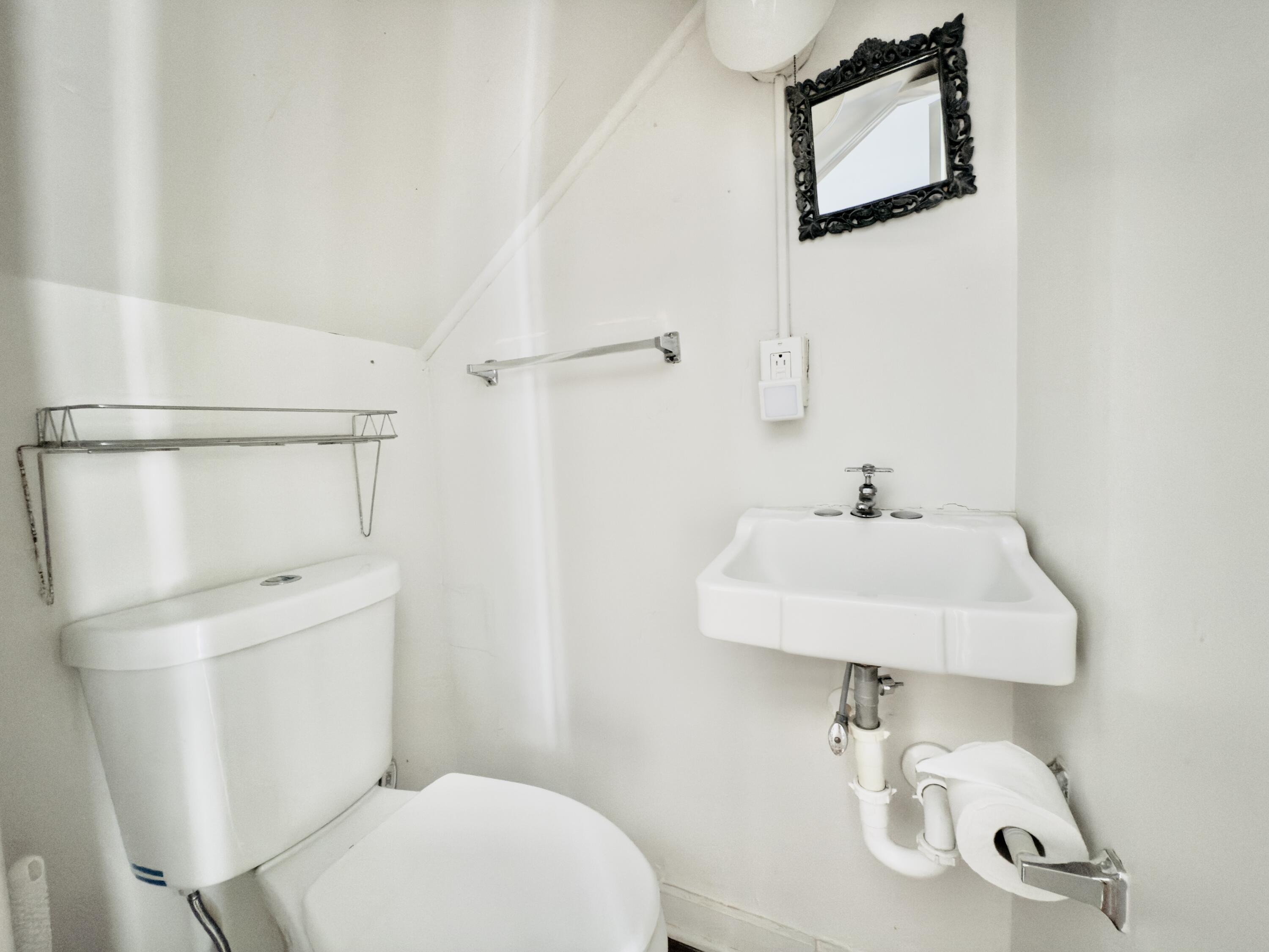 728 Ashe Street Key West, FL 33040 - Photo 9 of 25 a bathroom with a sink a toilet and shower