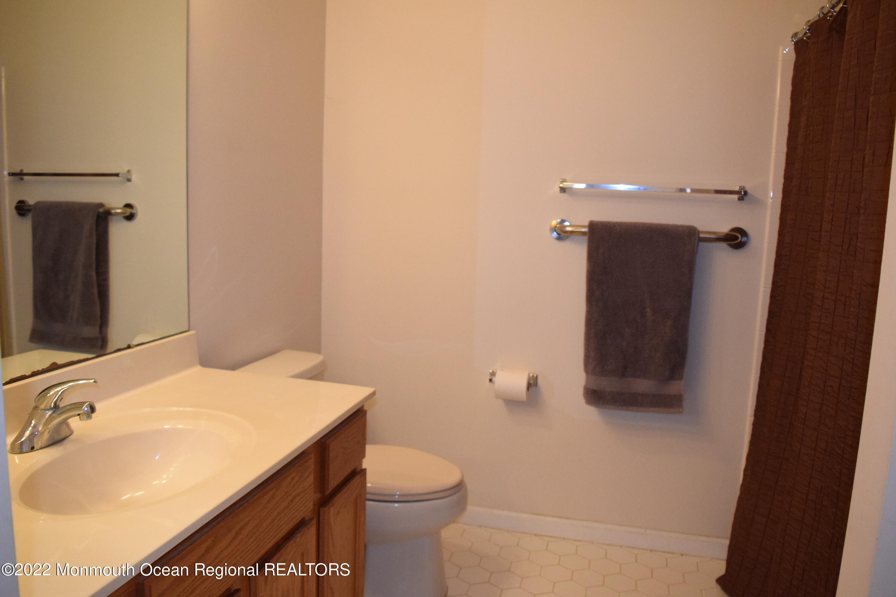 23 Foxwood Road Lakewood, NJ 08701 - Photo 15 of 34 a bathroom with a sink toilet and shower