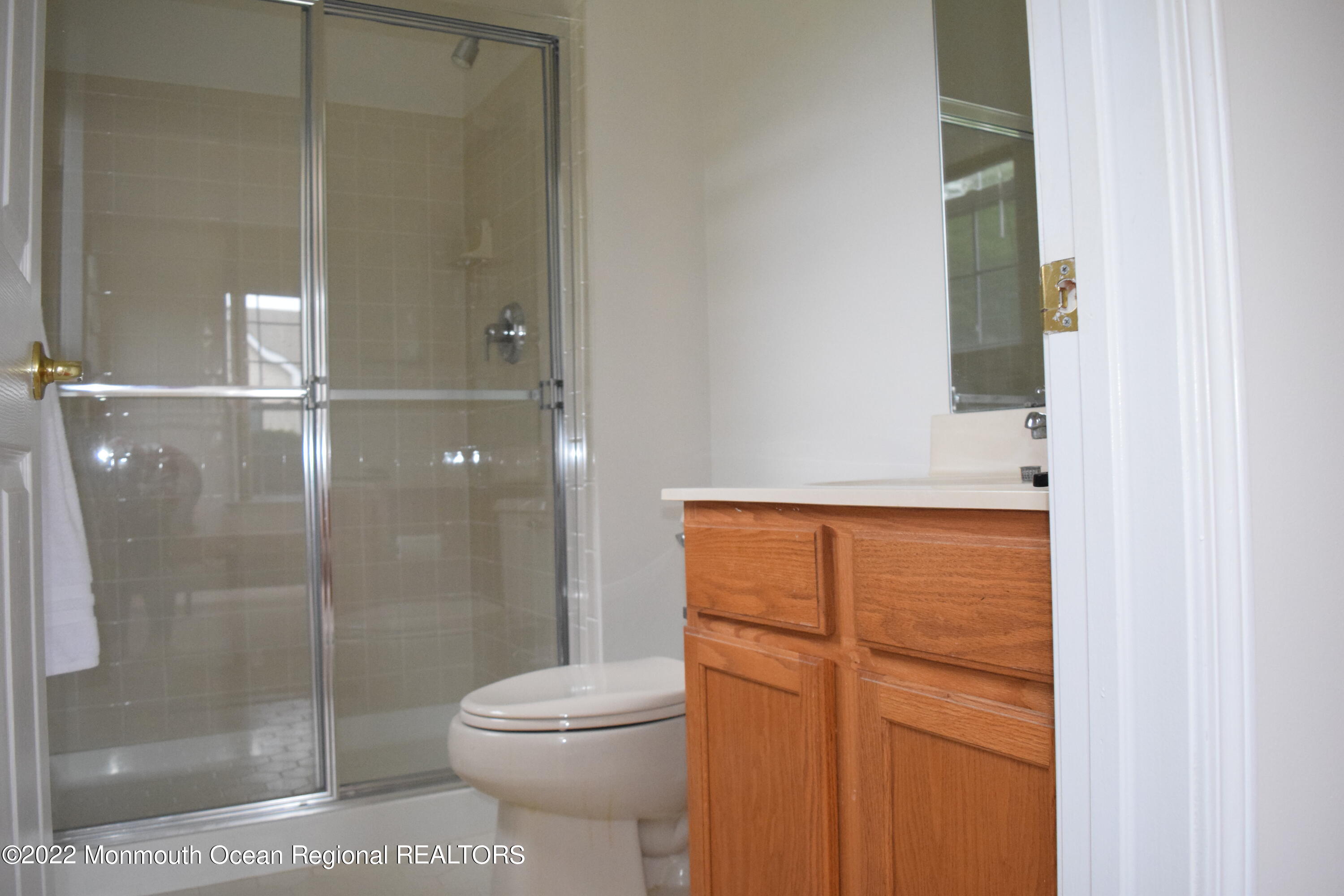 23 Foxwood Road Lakewood, NJ 08701 - Photo 20 of 34 a bathroom with a toilet and a shower