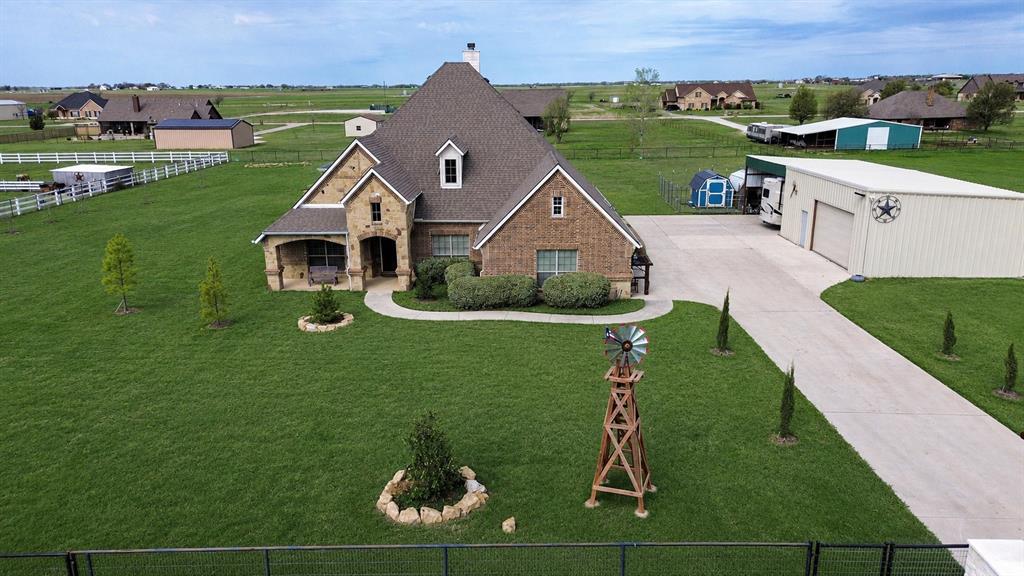 119 George Owens Road Ponder, TX 76259 - Photo 2 of 24 a aerial view of a house with a yard table and chairs