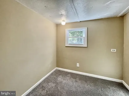 an empty room with a workbench