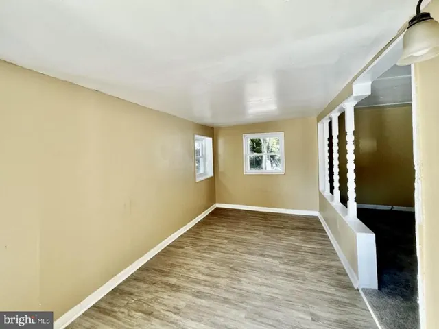 a view of an empty room and a window