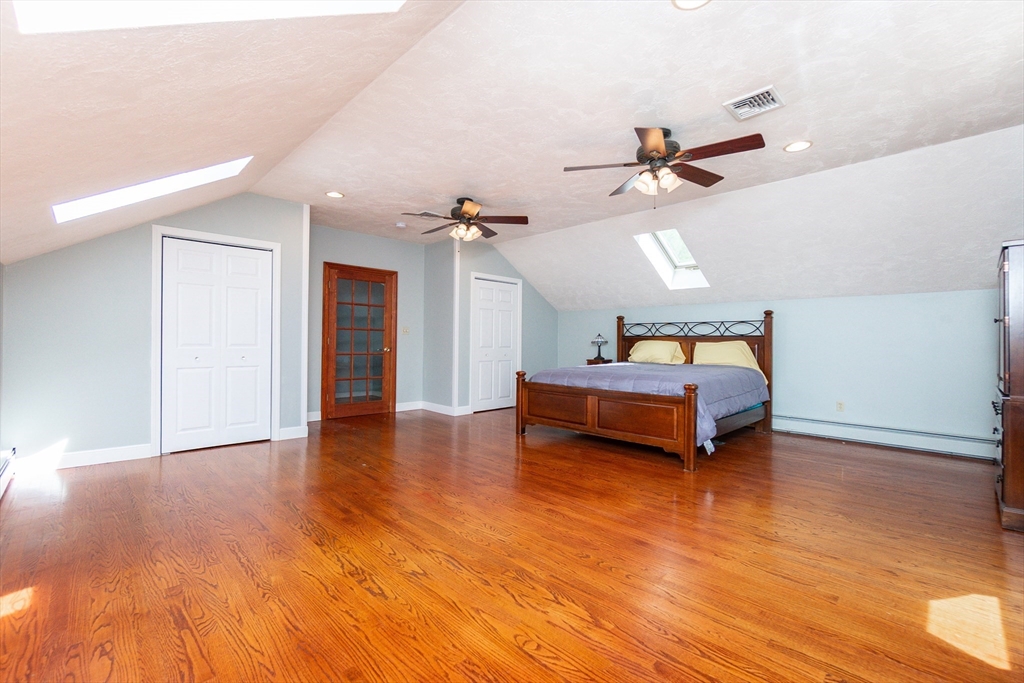 63 Bow Street Saugus, MA 01906 - Photo 14 of 42 a bedroom with furniture and wooden floor
