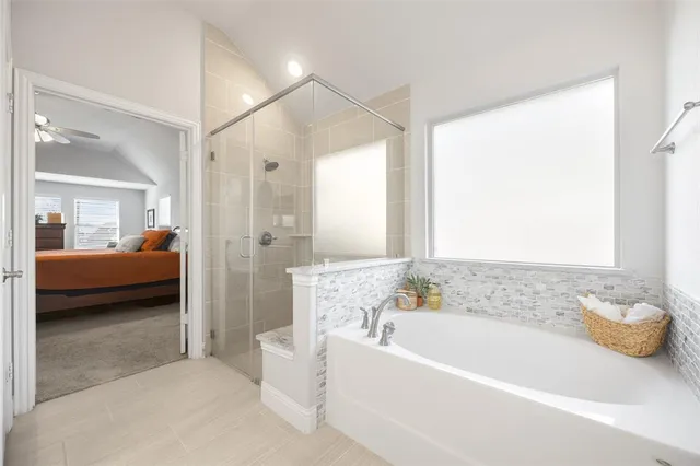 a bathroom with a bathtub and a shower