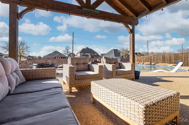 a view of a patio with couches and chairs
