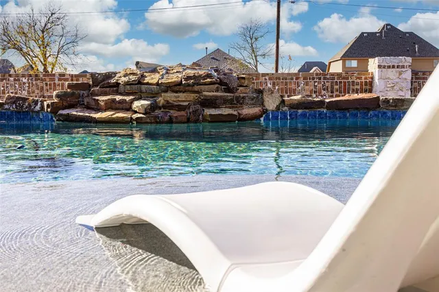 a view of a wooden house with a yard