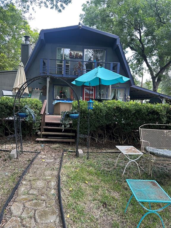 355 Spring Valley Street Gun Barrel City, TX 75156 - Photo 26 of 27 Charming two-story residence with a distinctive gambrel roofline and a second-story balcony