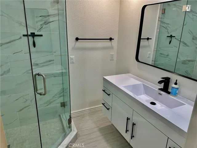 a bathroom with a sink and mirror