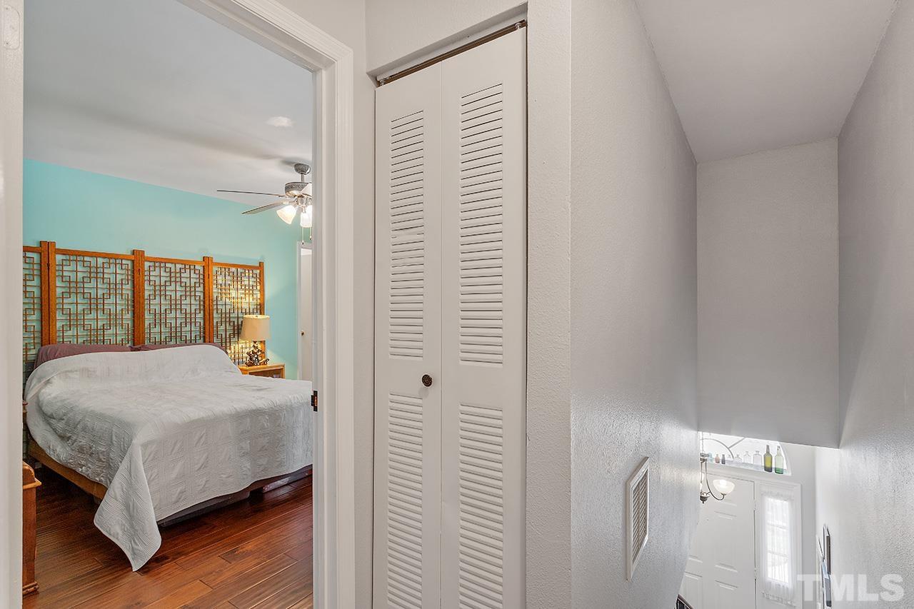 7819 Falcon Rest Circle, Unit END Raleigh, NC 27615 - Photo 32 of 38 a bedroom with a bed and a window
