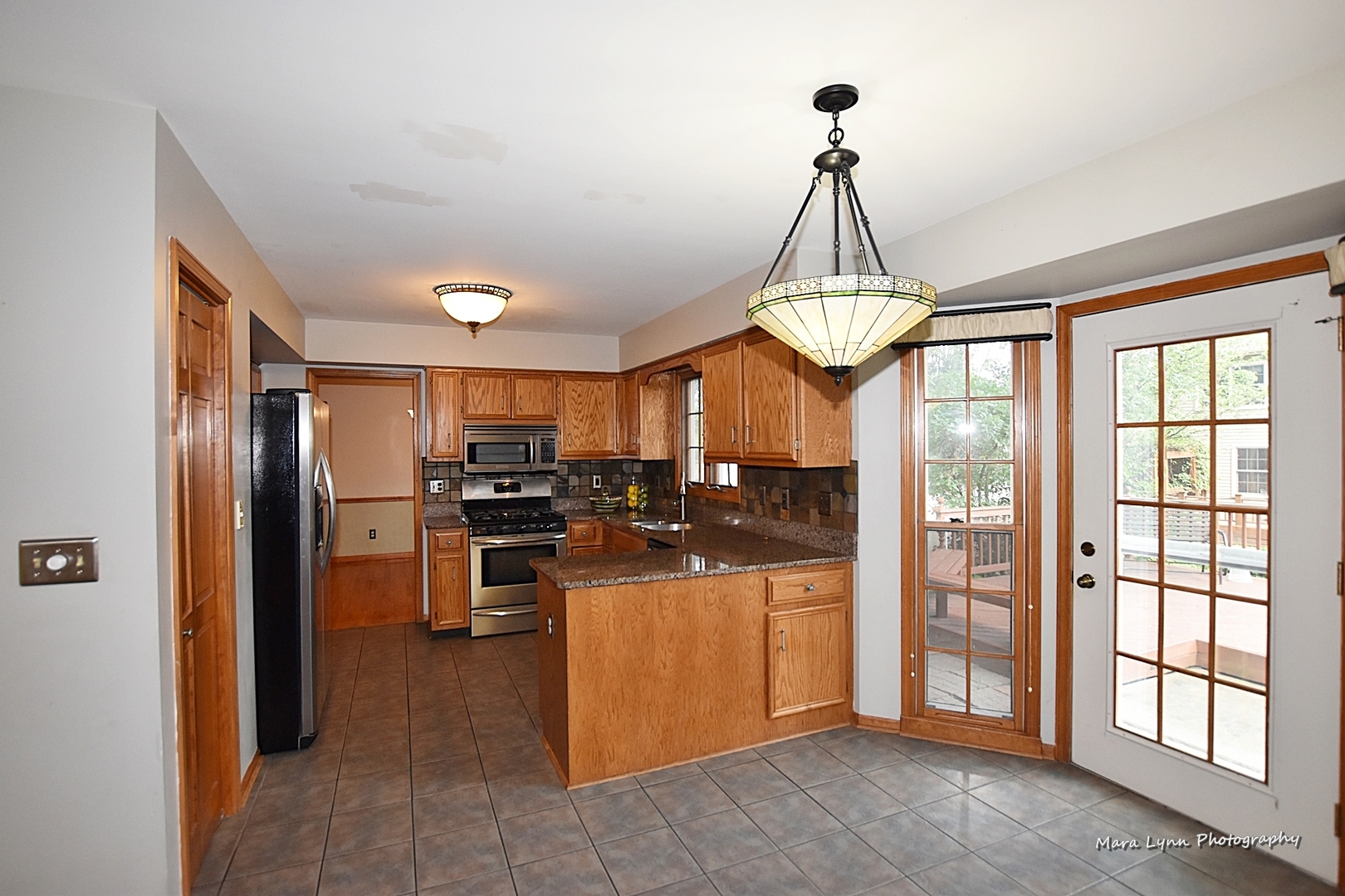 1105 Lewis Road Geneva, IL 60134 - Photo 14 of 38 a view of a kitchen with refrigerator and kitchen