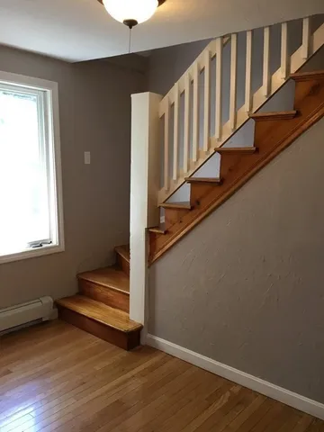 a view of entryway with wooden floor