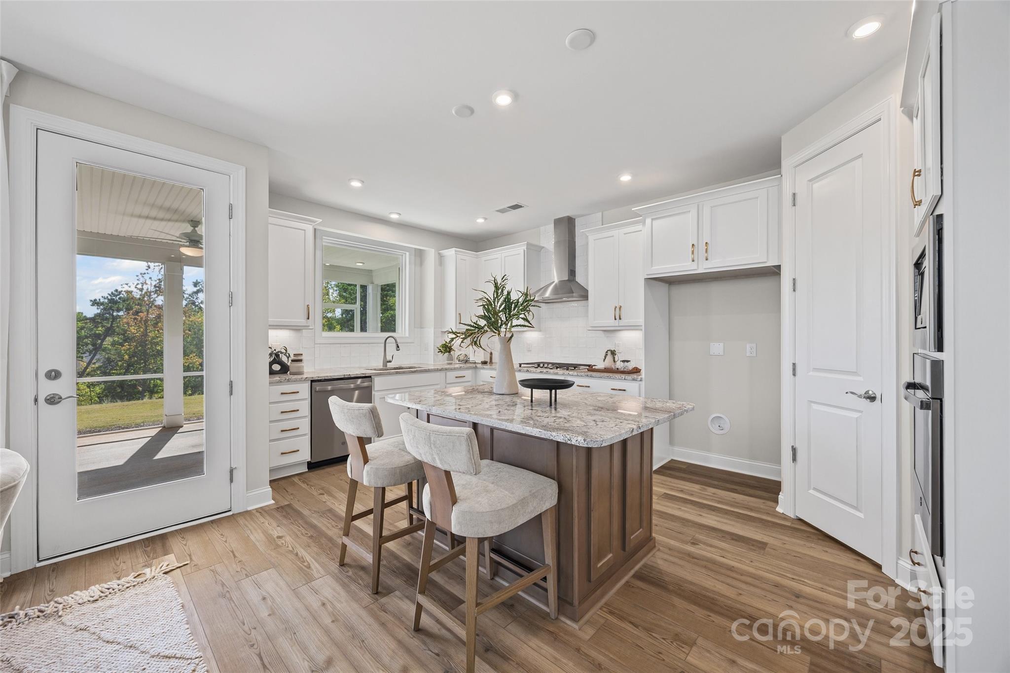 5075 Valita Road York, SC 29745 - Photo 11 of 48 a kitchen with stainless steel appliances a dining table chairs refrigerator and sink