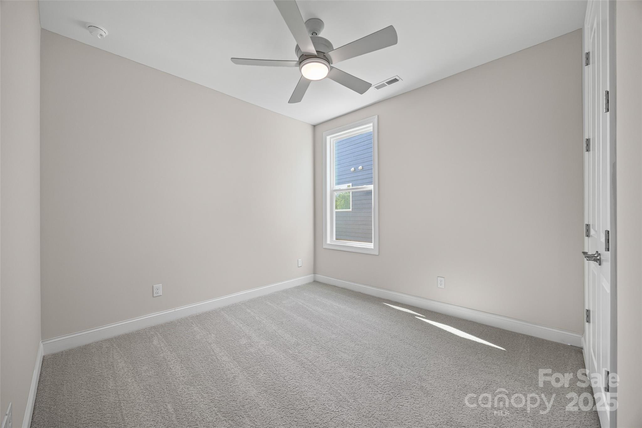 5075 Valita Road York, SC 29745 - Photo 21 of 48 an empty room with a window and a fan