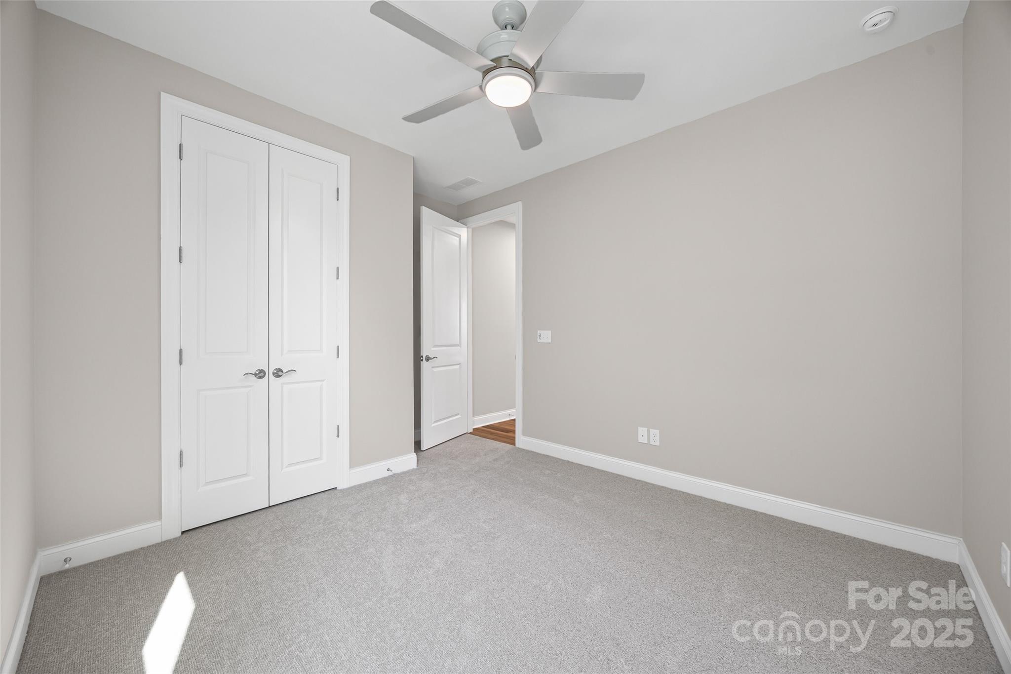 5075 Valita Road York, SC 29745 - Photo 22 of 48 an empty room with closet and a chandelier fan