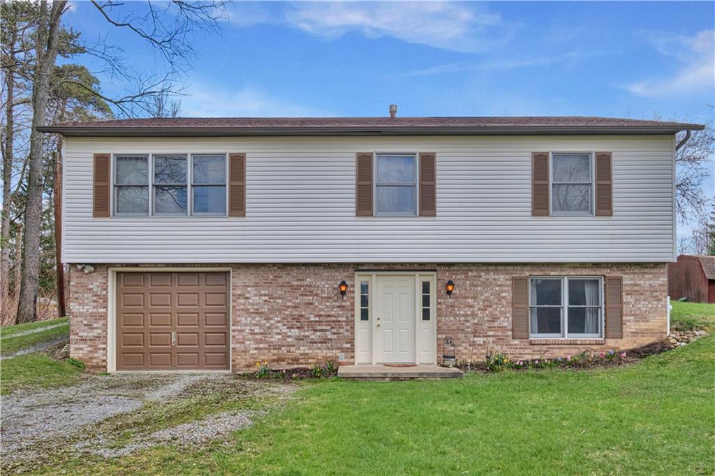 374 Goldsmith Road Pittsburgh, PA 15237 - Photo 1 of 25 a brick house with a yard