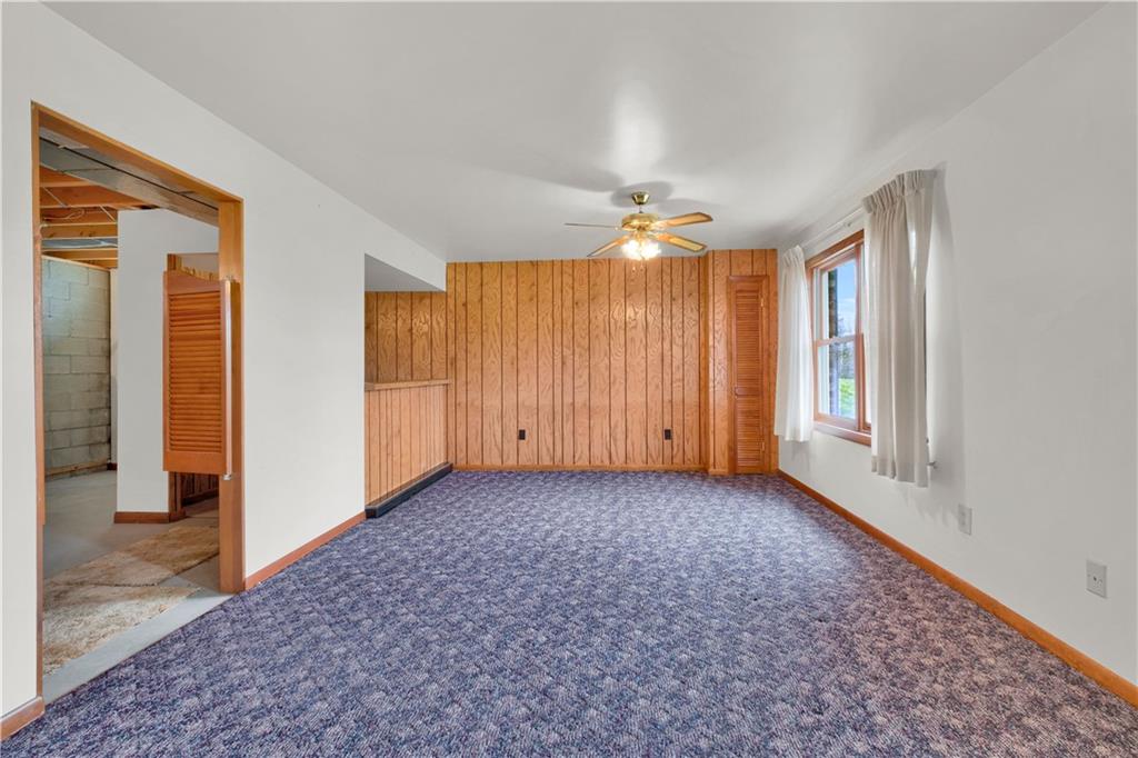 374 Goldsmith Road Pittsburgh, PA 15237 - Photo 18 of 25 an empty room with windows and chandelier fan