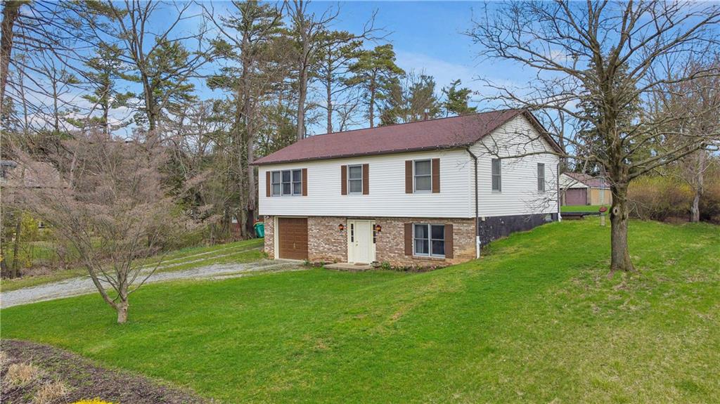 374 Goldsmith Road Pittsburgh, PA 15237 - Photo 2 of 25 a house that is sitting in the grass