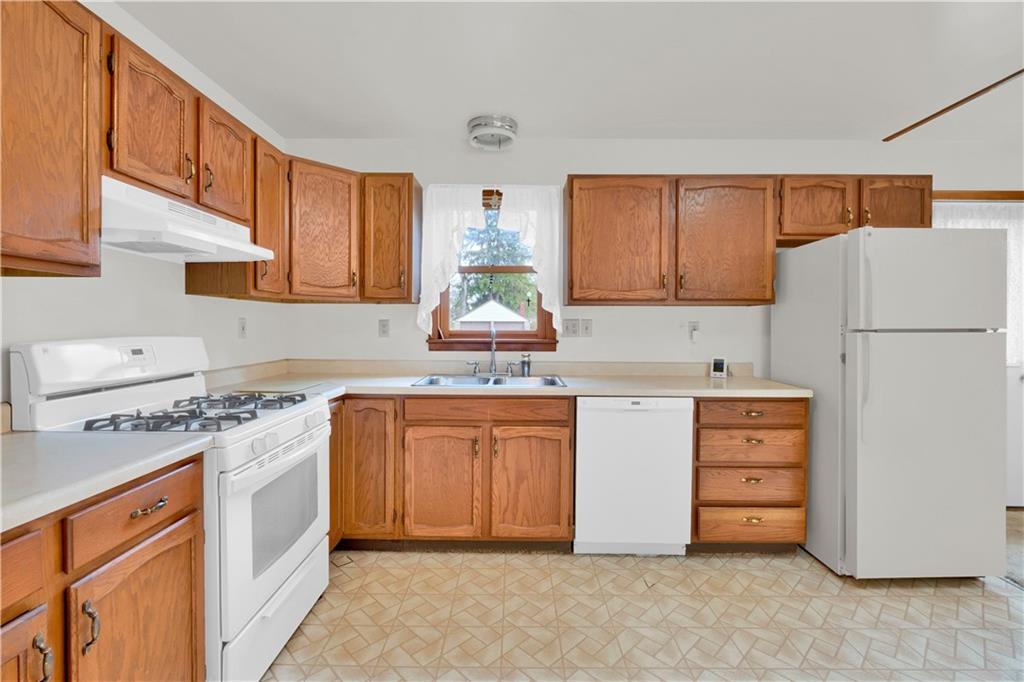 374 Goldsmith Road Pittsburgh, PA 15237 - Photo 7 of 25 a kitchen with cabinets appliances a sink and a window