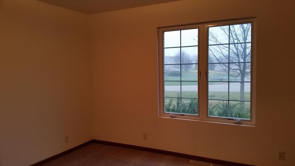 7031 Rye Ridge Trail Cherry Valley, IL 61016 - Photo 12 of 13 an empty room with a window