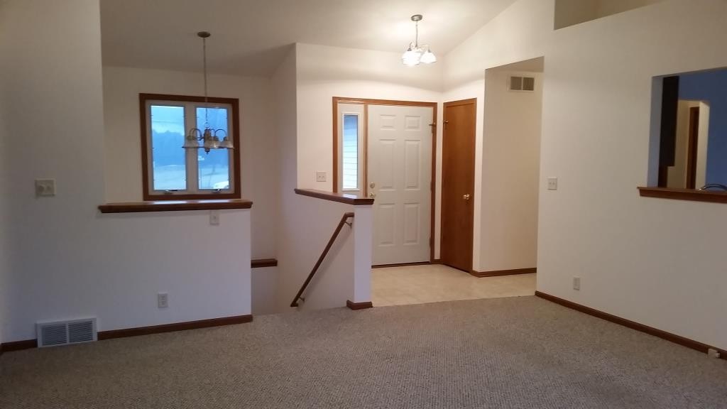 7031 Rye Ridge Trail Cherry Valley, IL 61016 - Photo 5 of 13 an empty room with windows