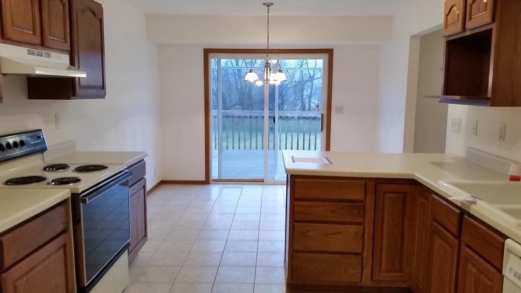 7031 Rye Ridge Trail Cherry Valley, IL 61016 - Photo 8 of 13 a kitchen with a stove and a sink