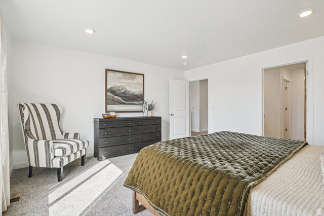 2097 North Ostler Peak Road, Unit 115 Heber City, UT 84032 - Photo 6 of 33 Bedroom featuring light-colored carpeting and white walls