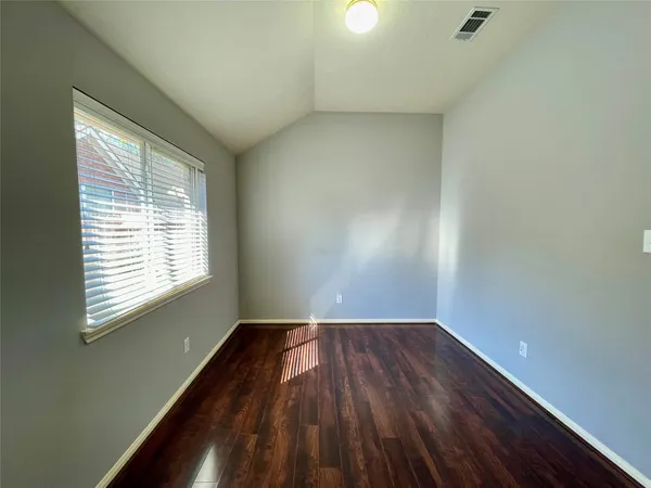 a white toilet sitting next to a bath tub