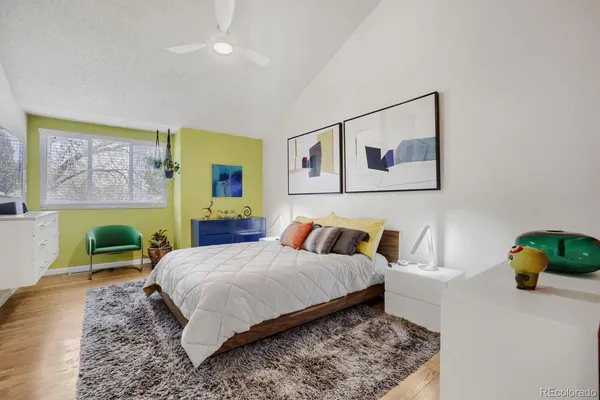 a bedroom with a bed and dresser