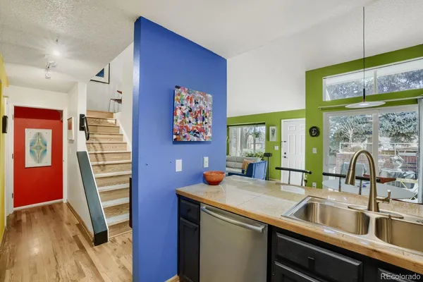 a kitchen with a sink and a refrigerator