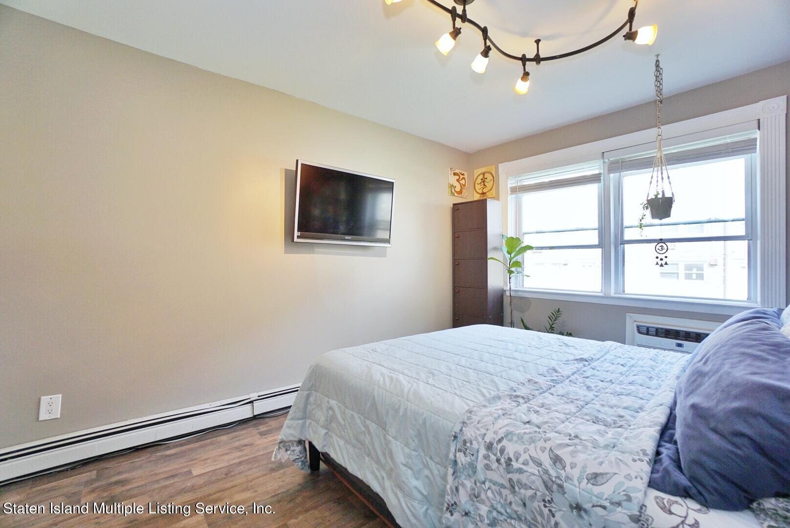 40 Racal Court, Unit B1 Staten Island, NY 10314 - Photo 13 of 16 a bedroom with a bed and a window