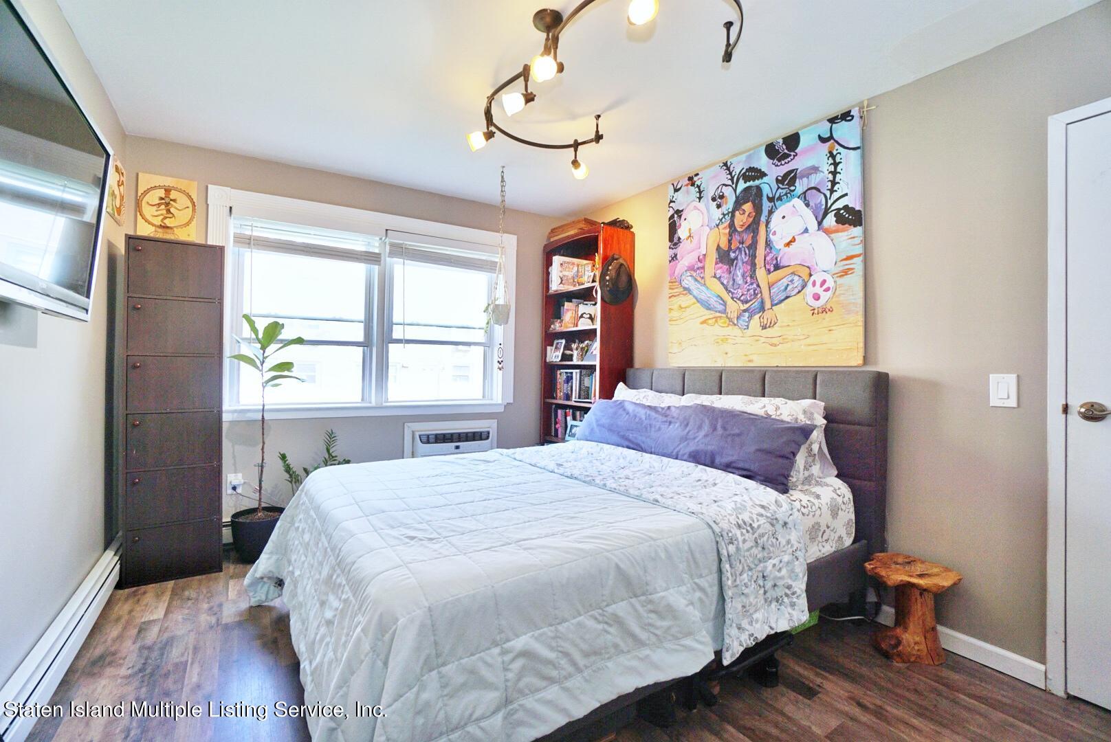 40 Racal Court, Unit B1 Staten Island, NY 10314 - Photo 14 of 16 a bedroom with a bed and a window