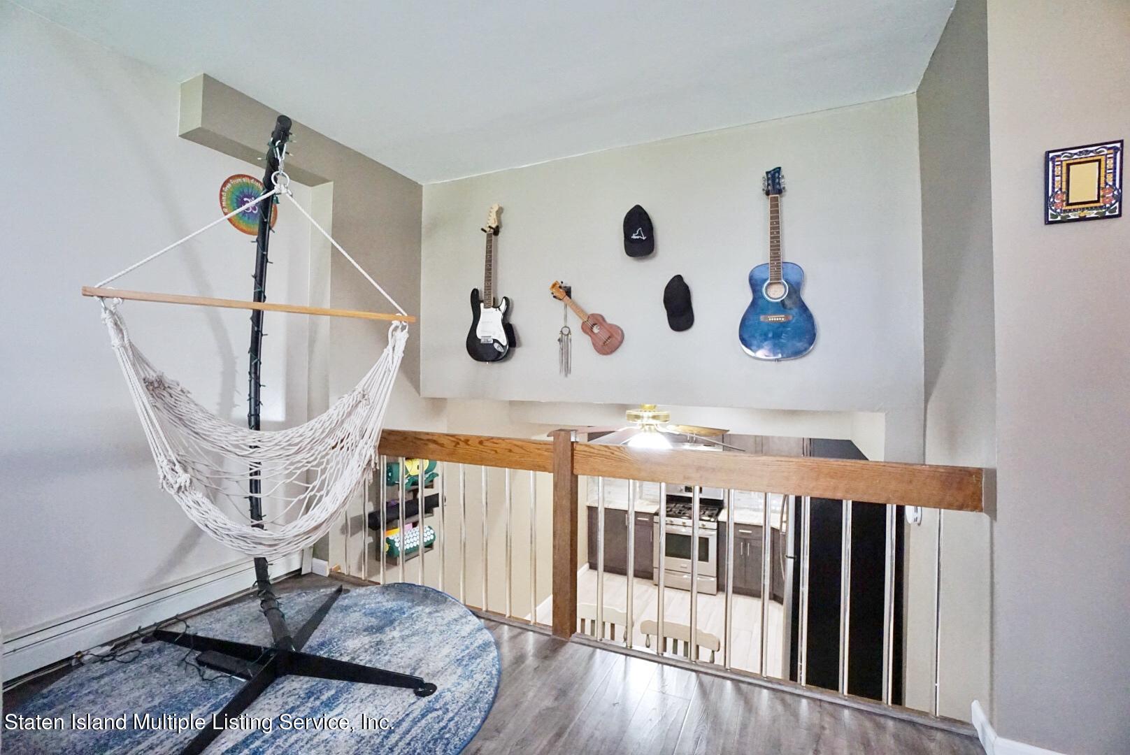 40 Racal Court, Unit B1 Staten Island, NY 10314 - Photo 9 of 16 a view of a hallway with wooden floor and entryway