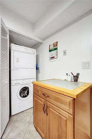 a living room with furniture a table and wooden floor