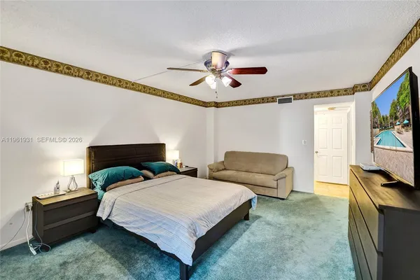 a bathroom with a double vanity sink mirror and toilet