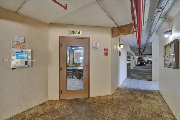 a view of a hallway with a dining area