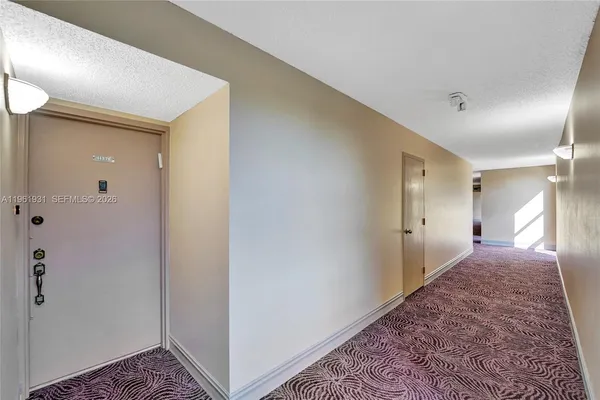 a large kitchen with stainless steel appliances granite countertop a stove refrigerator sink and cabinets