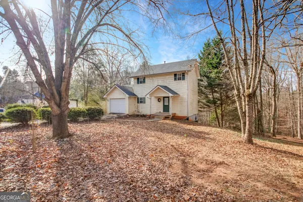 a house with trees in front of it