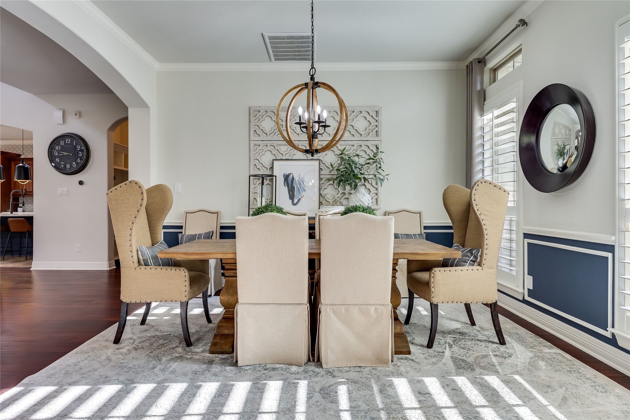 401 Bluff View Road Cedar Park, TX 78613 - Photo 30 of 40 Rich hardwood flooring complements this elegant dining area, perfectly illuminated by a rustic-chic chandelier.