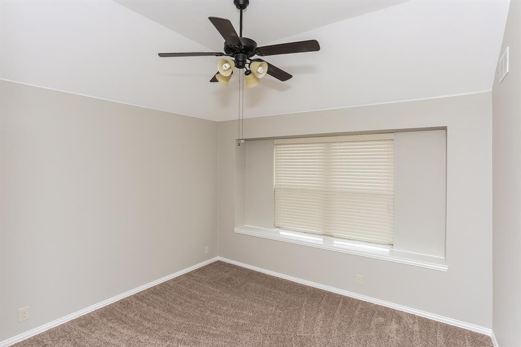 921 Lucetta Street Midlothian, TX 76065 - Photo 11 of 15 an empty room with a window and a ceiling fan