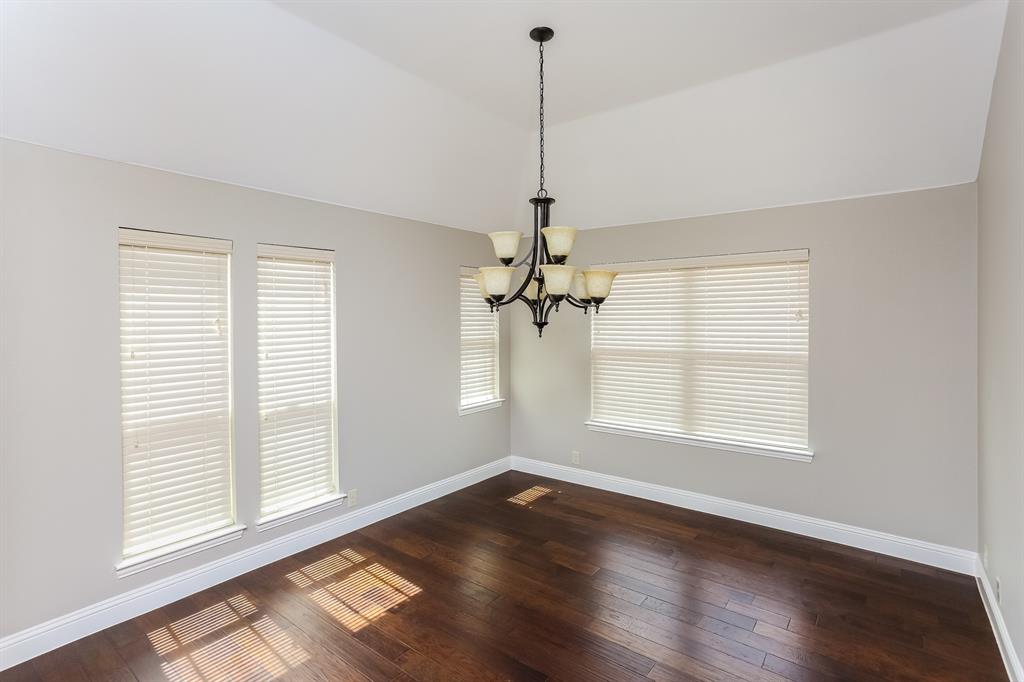 921 Lucetta Street Midlothian, TX 76065 - Photo 3 of 15 a view of an empty room with a window and wooden floor