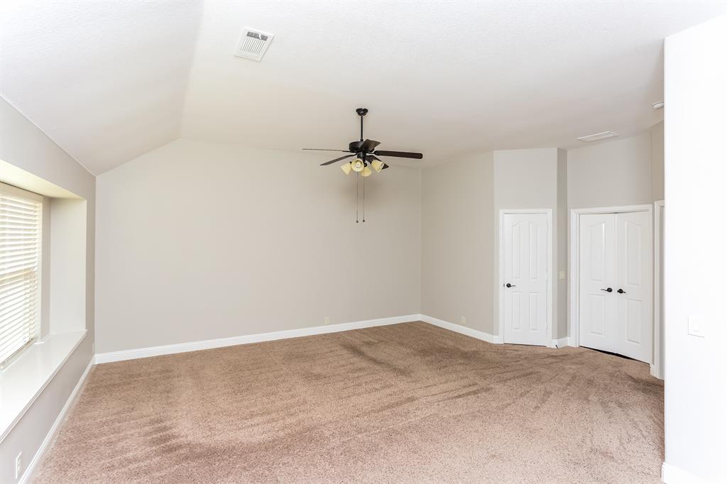 921 Lucetta Street Midlothian, TX 76065 - Photo 7 of 15 a view of a room with a ceiling fan and window