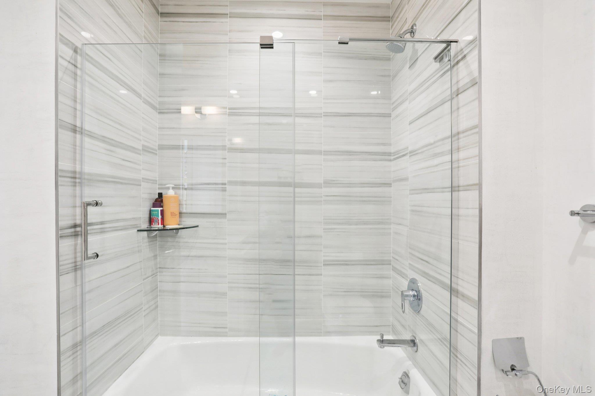 175 Huguenot Street, Unit PH302 New Rochelle, NY 10801 - Photo 15 of 25 a bathroom with a shower