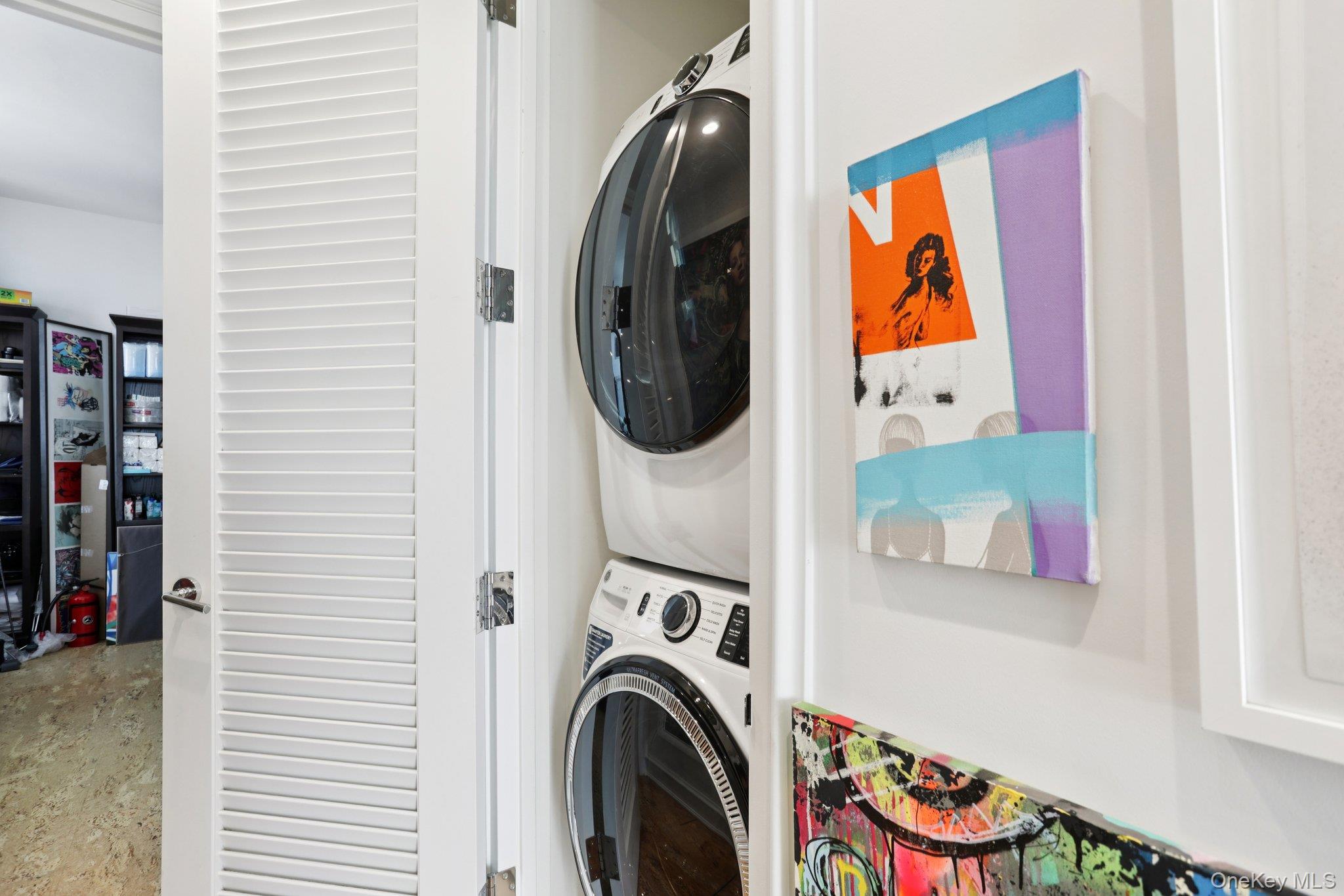175 Huguenot Street, Unit PH302 New Rochelle, NY 10801 - Photo 16 of 25 a utility room with dryer and washer