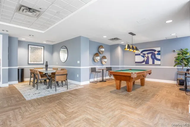 a living room with furniture a table and chairs