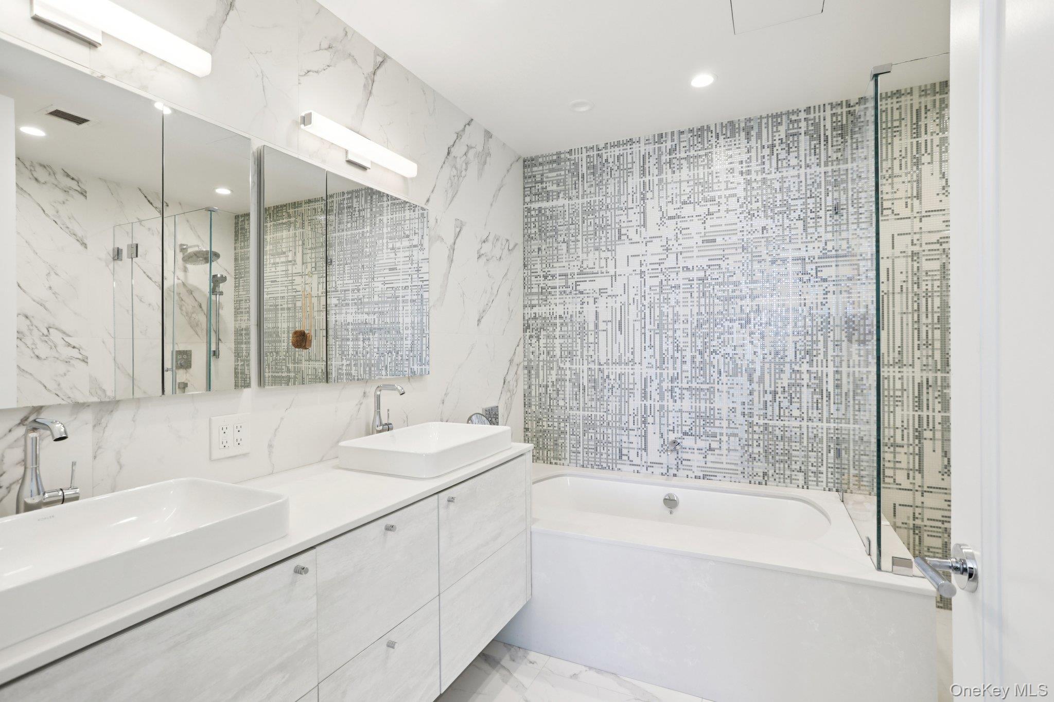 175 Huguenot Street, Unit PH302 New Rochelle, NY 10801 - Photo 8 of 25 a bathroom with a bathtub and a sink