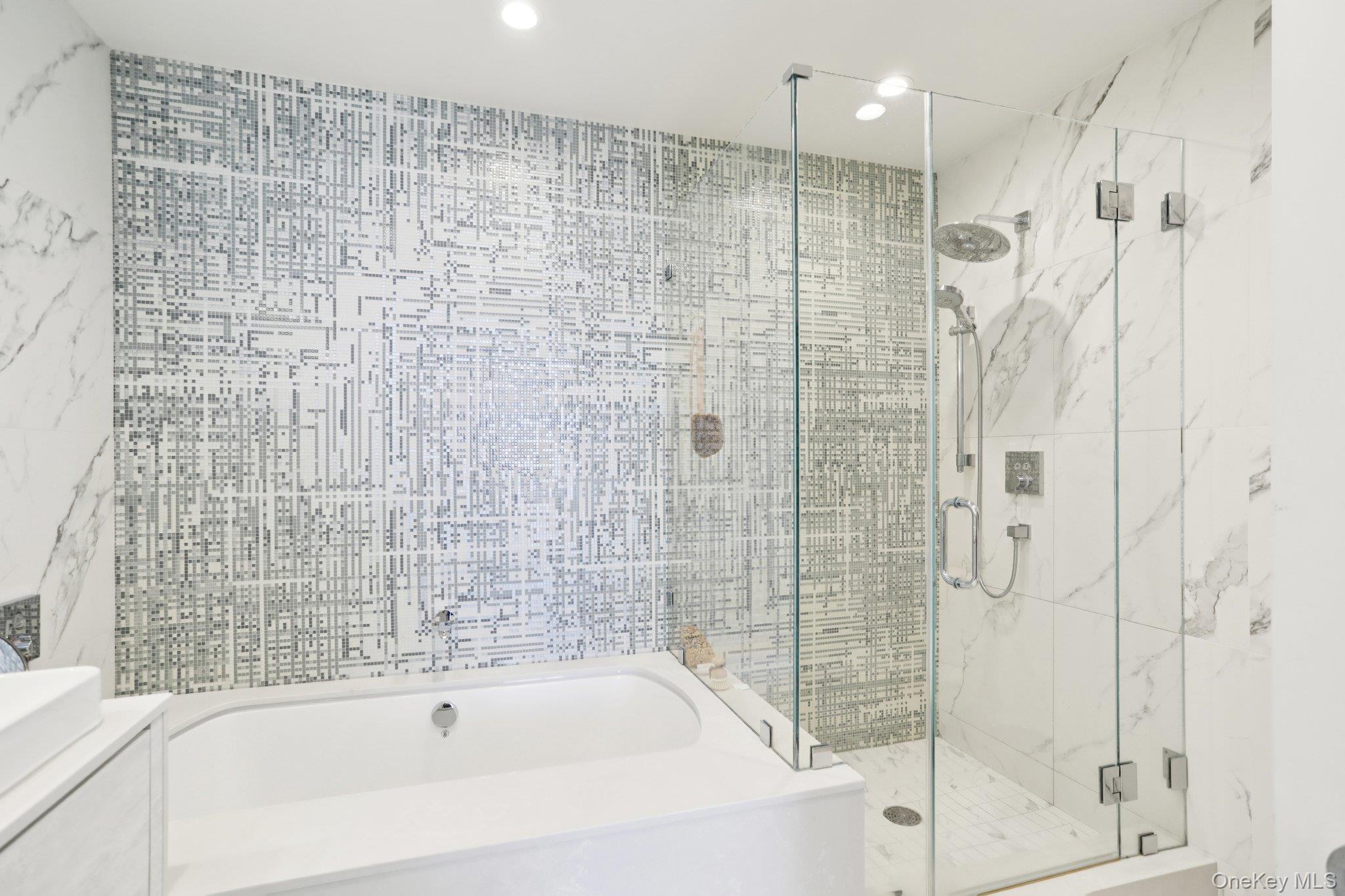 175 Huguenot Street, Unit PH302 New Rochelle, NY 10801 - Photo 9 of 25 a bathroom with a bathtub and a shower