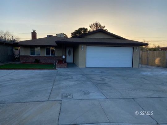 209 South Fire Opal Street Ridgecrest, CA 93555 - Photo 23 of 23 a view of a house with a yard and plants