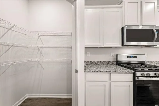 a kitchen with a stove and a microwave